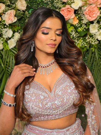 The lilac goddess. The soft purple tones in her makeup and outfit create a look that is both unique and incredibly beautiful.