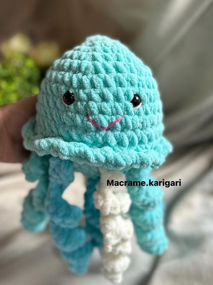 A front view of our happy little jellyfish. Its sweet smile and soft texture make it a comforting companion for newborns and toddlers.