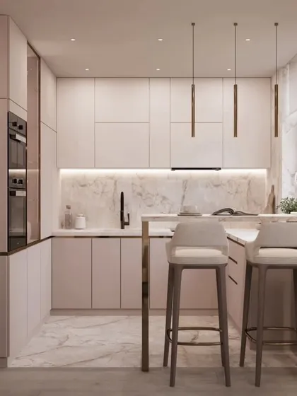 Another view of the pink kitchen, showing the integrated appliances and handleless cabinets that contribute to its sleek and modern design.