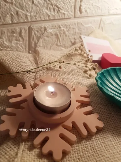 A single Snowflake T-light holder in a soft, neutral pink. This shows how our festive designs can also be customized in gentler colors for a more subtle holiday look.