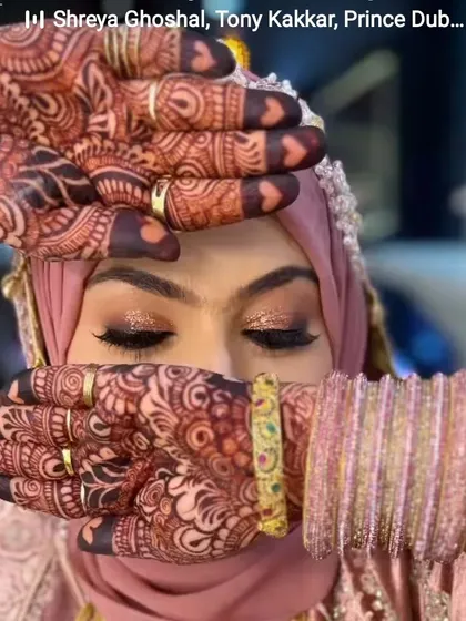 Another beautiful bride with a gorgeous, dark henna stain. The color looks so rich against her pink outfit and sparkling makeup.