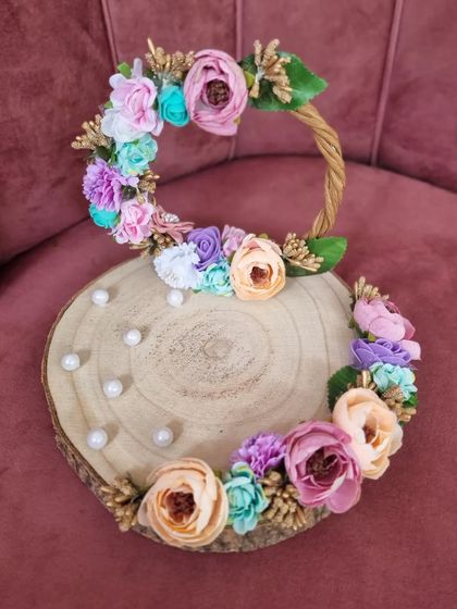 Our beautiful floral engagement ring platter, ready to be part of a special moment. The pastel flowers and natural wood create a rustic and elegant feel.