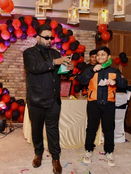 A paper-tearing trick with a young volunteer. Simple props can create the most amazing moments of magic and connection.