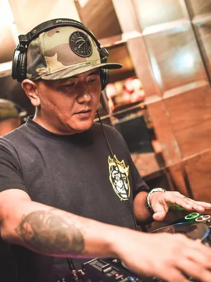 A close up shot of me working the mixer. Every track selection and transition is deliberate, all part of building the perfect party atmosphere.