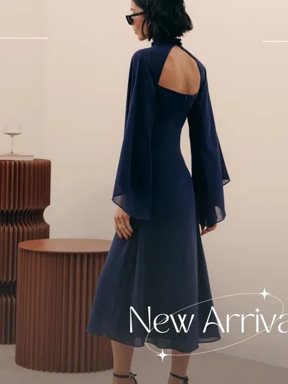 A look at the back of my signature Armani dress. The design features dramatic, flowing sleeves made from delicate organza and an open back, creating a sophisticated and modern statement for any special occasion.