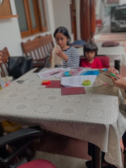 A quiet moment of concentration during one of our embroidery sessions. The studio is a place to unwind and focus on the simple, repetitive motion of the needle and thread.