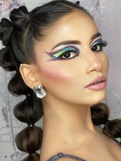 This high-fashion look combines a creative, multi-toned graphic eye with a unique bubble braid hairstyle. I encourage my students to experiment and create head-to-toe concepts.
