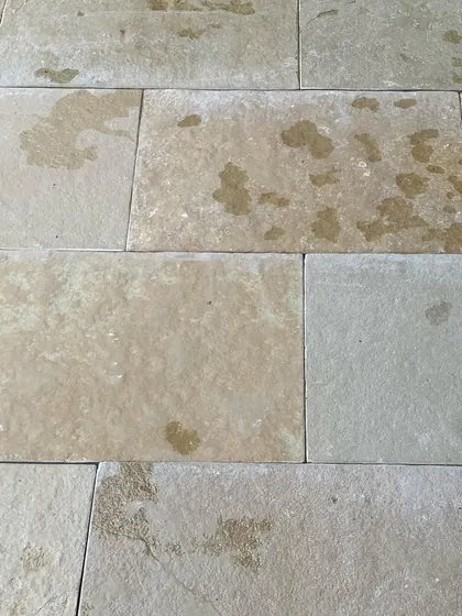 Local Tandur stone tiles, with their natural imperfections and earthy tones, are laid out on site. The choice of material is fundamental to creating an architecture that feels authentic and connected to its place.