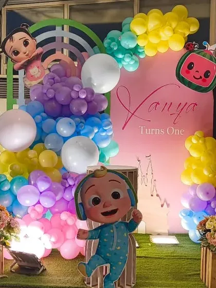 Cocomelon is a favorite, and I create vibrant, character-filled scenes that kids adore. This setup includes large cutouts of JJ and friends, a colorful balloon cascade, and a personalized backdrop, making it the perfect photo spot.