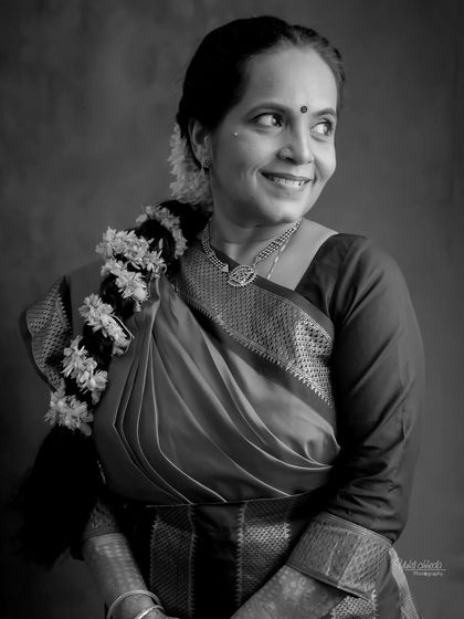 A beautiful black and white portrait of the mother, her joyful smile captured perfectly.