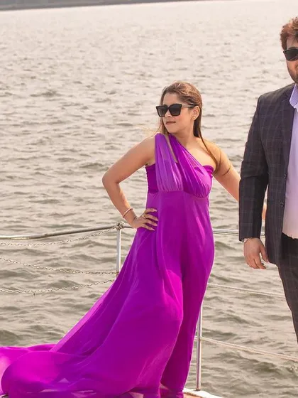 A confident and stylish pose by the couple on a yacht, perfect for a glamorous destination pre-wedding album.