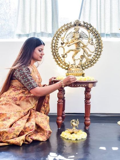 A moment of reverence with the Nataraja idol during the studio's opening ceremony.
