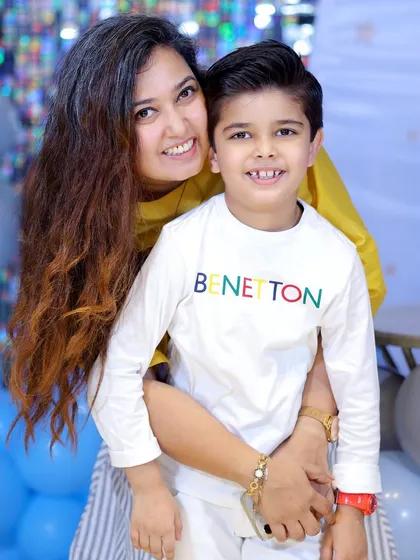 A warm hug between a mother and her son during his birthday photoshoot. These are the cherished family portraits that last a lifetime.