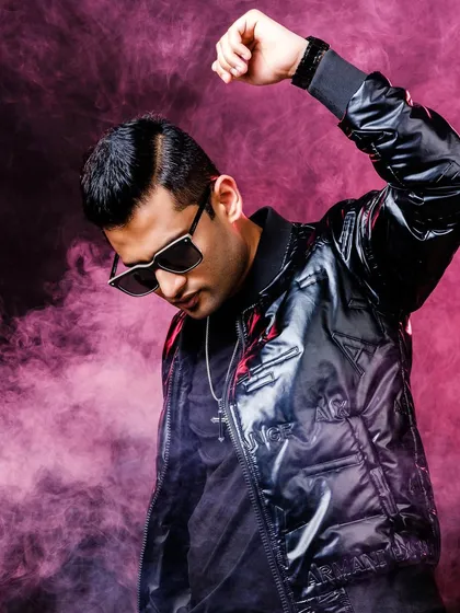 This is me, ready for the next show. Behind the high-energy persona is a deep focus and dedication to my craft, always thinking about how to make the next event even more memorable.