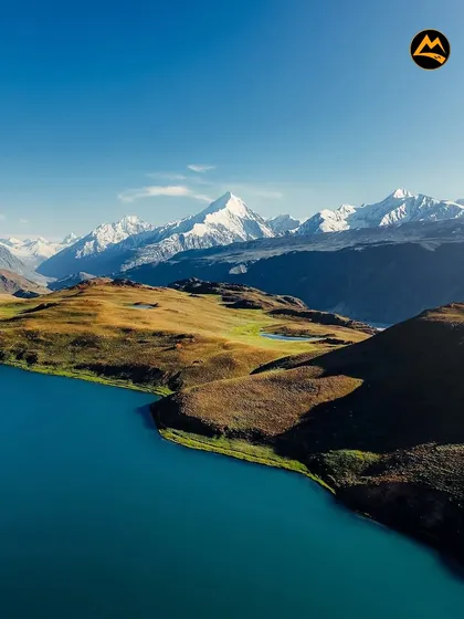 The incredible blue of a high-altitude lake against the backdrop of snow-capped peaks in the Spiti region. This is the kind of view that stays with you forever.