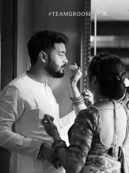 A candid, black and white photo of a pre-ceremony ritual for the groom's team. These behind the scenes moments add depth to the wedding story.