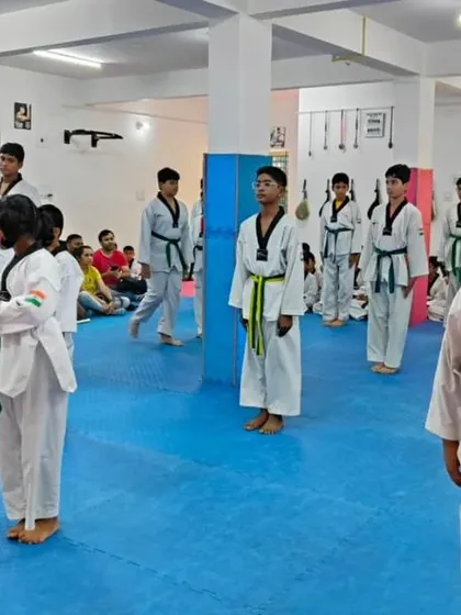 Students standing at attention during a belt exam.