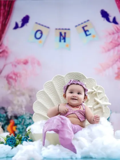 A wide shot showing the full mermaid setup, perfect for celebrating a first birthday in enchanting style.