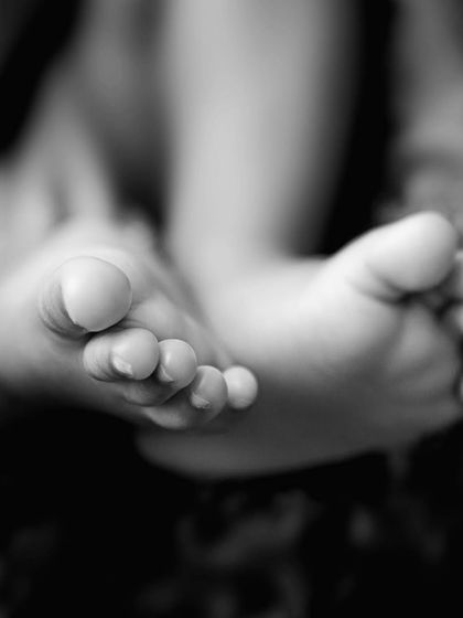 Ten tiny toes. A classic black and white macro shot of newborn feet is a must-have for every parent. You'll be amazed at how quickly they grow out of this stage.