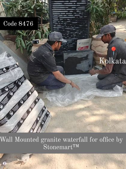 My team packs the wall-mounted granite waterfall for the office in Kolkata.
