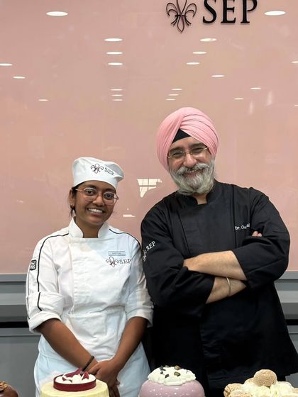 A photo with the respected Dr. O.S. Kandhari from my pastry school. Learning from such experienced chefs was an invaluable part of my education.