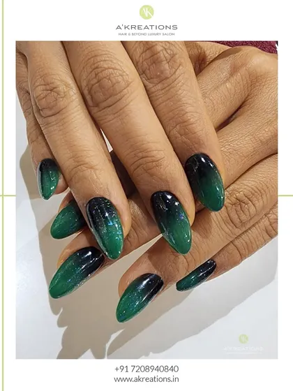 A different angle of the emerald ombre nails, showcasing the rich color depth and flawless glossy finish that makes this design so captivating.