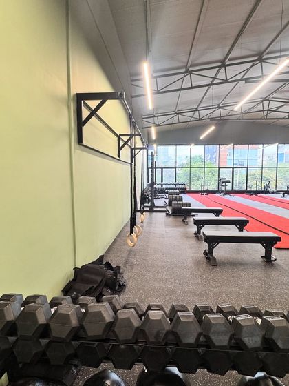 A glimpse of the functional training area in our gym. We have everything you need, from dumbbell racks and pull-up bars to gymnastic rings, to build a well-rounded physique.