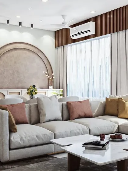 For larger, open-plan homes, I focus on creating distinct zones that still feel connected. This spacious living area features a plush, oversized L-shaped sofa for ultimate comfort, while an elegant arched feature wall in the background defines the dining space with a touch of architectural grace.