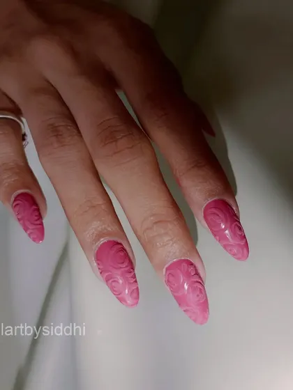 Another view of the textured 3D rose pattern nails.