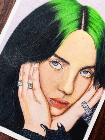 My finished colored pencil portrait of Billie Eilish, capturing her iconic green and black hair. I used Derwent Chromaflow pencils to get the vibrant green just right.