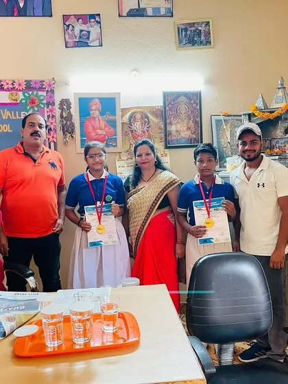Distributing medals and certificates at Modern Green Valley Public School after a successful national championship.