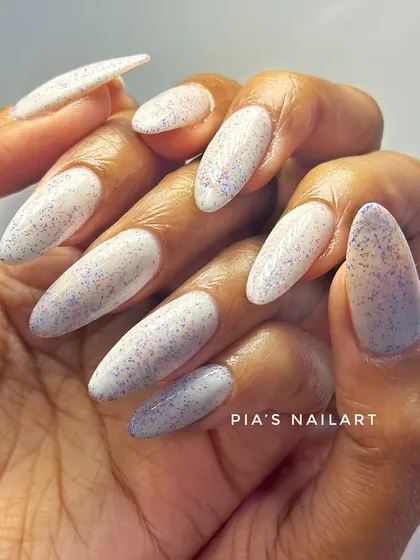 Another look at the speckled "mixy" polish on long almond-shaped nails.