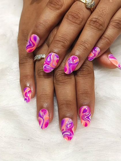 A groovy and abstract design featuring a marbled swirl of pink, purple, and orange. This look is all about vibrant color and free-flowing patterns.