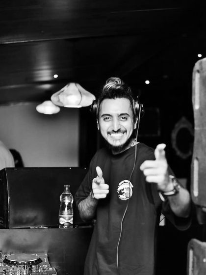 A black and white version of one of my favorite poses, pointing at you. It's a direct invitation to be part of the experience.