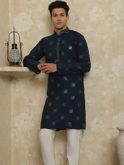 This navy blue kurta with silver booti work is a classic choice for any family function. It's lightweight, stylish, and keeps you cool.