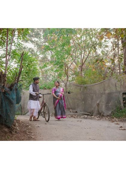 A walk down a village path. This retro-themed shoot captures a simple, bygone era, with the vintage bicycle adding a perfect touch of nostalgia.