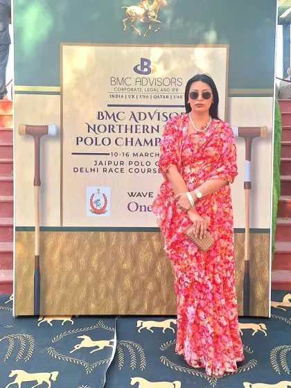 Posing at the Jaipur Polo Ground. The draped silhouette of this floral saree is comfortable for a long day of socializing and watching the match.