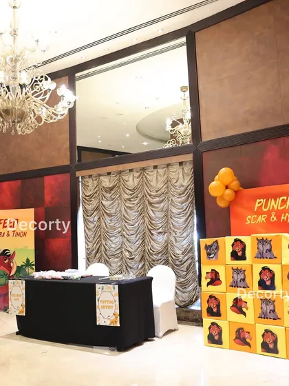 An overview of the activity zone, featuring the "Feed Pumbaa & Timon" and "Punch Scar & Hyena" game stations. I ensure there's plenty of themed entertainment to keep kids engaged.