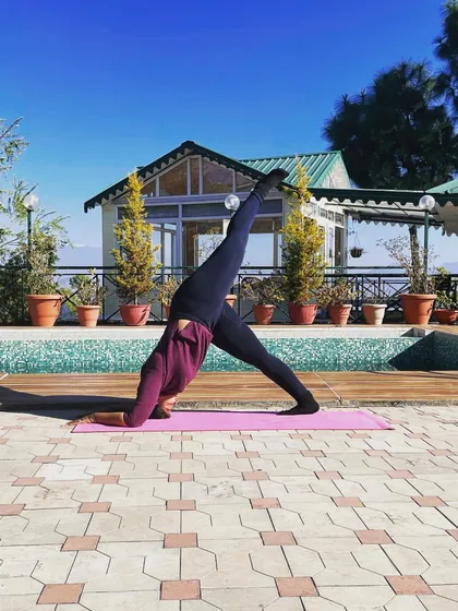 Practicing a one-legged dolphin pose by the pool while traveling. Yoga is a lifestyle that you can take with you anywhere. I am grateful for every chance I get to practice in beautiful places.