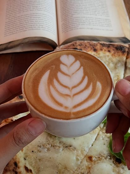 A close-up of our latte art. We put as much care into our coffee as we do our pizza.