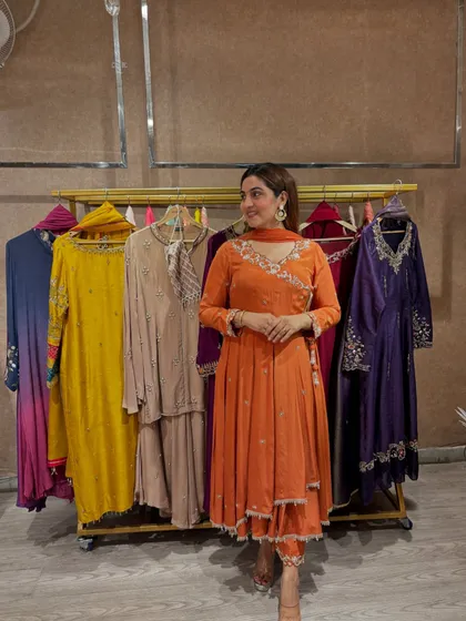 The rich color palette in this boutique shows the variety I explore with my clients. The orange suit stands out as a vibrant yet sophisticated choice for any celebration.