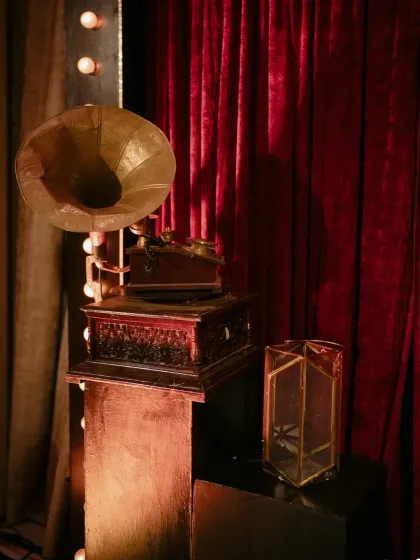 A vintage gramophone adds a touch of old-world charm to a welcome soirée. We believe in using unique decor elements to tell a story and create a specific mood.
