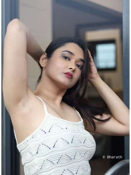 A clean and modern portrait with a dynamic pose. This style is perfect for a contemporary portfolio or headshot.