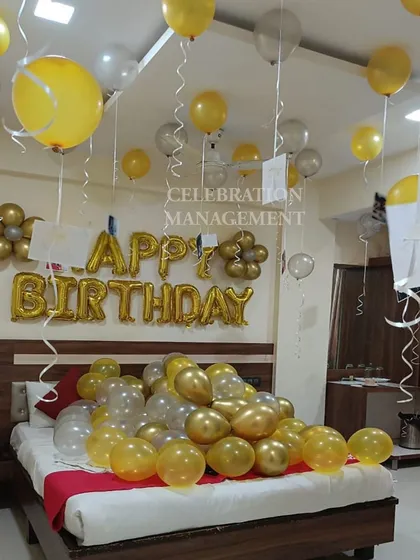The combination of yellow, gold, and silver balloons creates a bright and festive atmosphere, perfect for waking up to on your birthday.