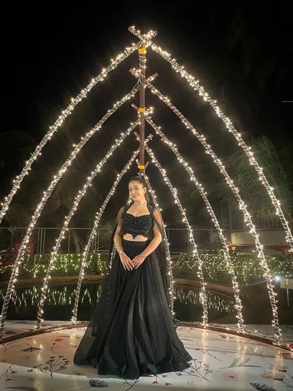 In a world full of lights, I shine with my own energy. This picture captures the vibe of a reception night, where I'm ready to host an unforgettable party.