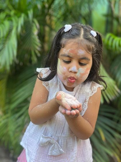 Blowing away the colourful, natural clay powder. My Holi colours are so fine and soft, making them fun and safe for everyone to play with.