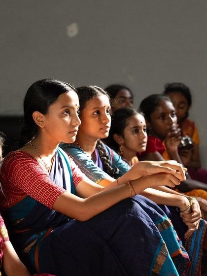 A quiet moment of observation during a screening of 'P A D A M'. Learning is not just about dancing; it is also about watching, listening, and absorbing the art form in all its dimensions.