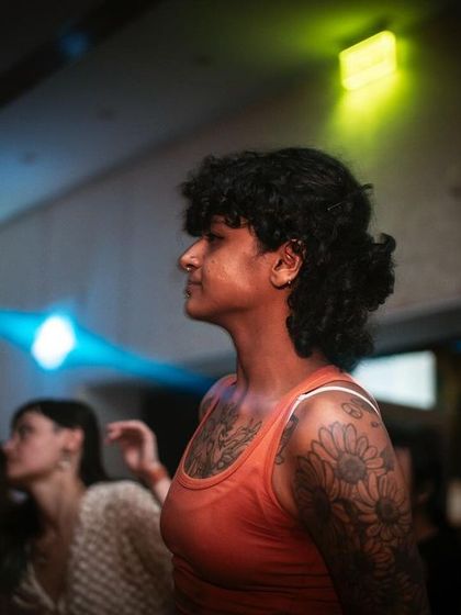 A guest lost in the music during the Mixmag Lab event. We create spaces where people can truly connect with the sound and the moment.