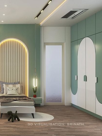 A view of the kids' bedroom showing the custom wardrobe with playful, curved door designs that match the room's overall theme.