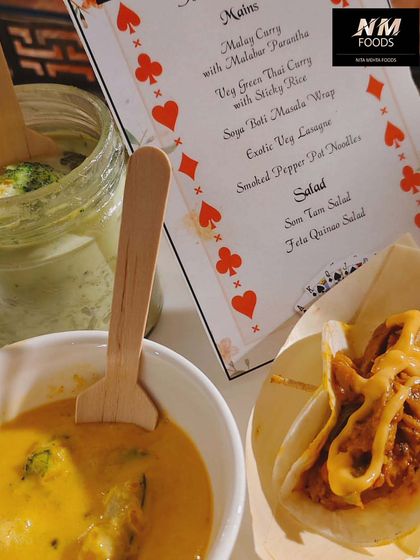 A glimpse of a customized menu we created for a card-themed party. We love tailoring our food, like these tacos and Thai curry bowls, to match your event's theme perfectly.